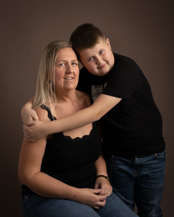 mother and young son dressed in black tops